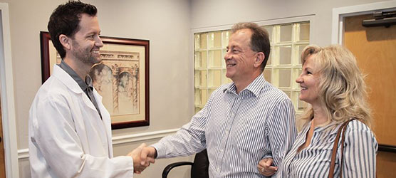 Chiropractor Winter Park FL Matthew Rumley Meeting Patient